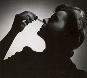 Untitled (woman with nose dropper), 1936-1939, Volume of 21 photographs by Max Dupain by Max Dupain