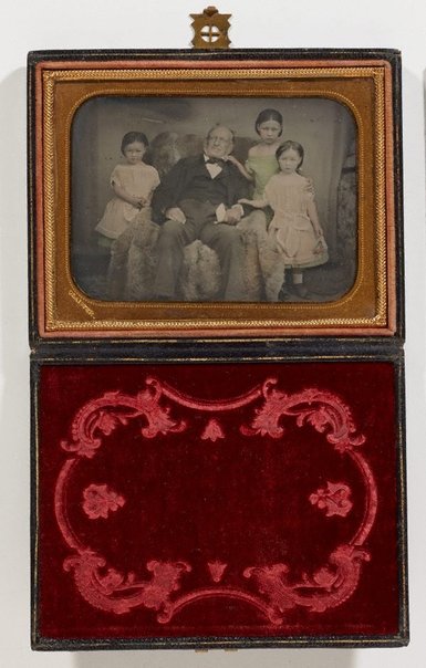 An image of Untitled (portrait of a man and three girls) by Glaister studio