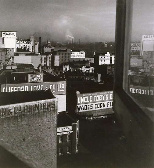 An image of City rooftops by Olive Cotton