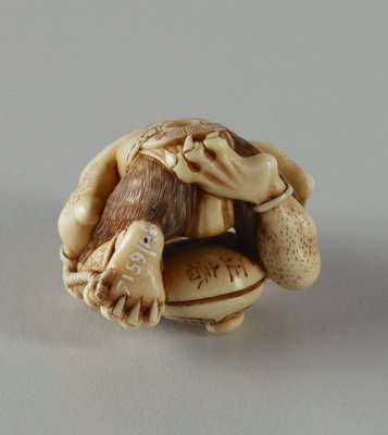 Alternate image of Netsuke in the form of a demon chanting Buddhist sutra by