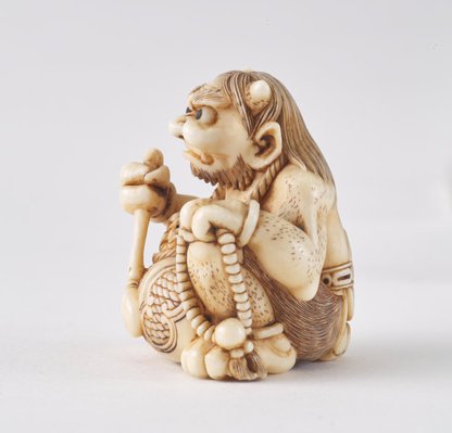 Alternate image of Netsuke in the form of a demon chanting Buddhist sutra by