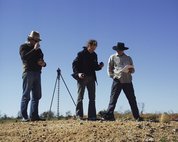 Laing and assistants in 2003 in the Tanami Desert, shooting the series *one dozen unnatural disasters in the Australian landscape*. Photo Peter Burgess.