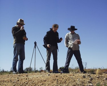 Laing and assistants in 2003 in the Tanami Desert, shooting the series *one dozen unnatural disasters in the Australian landscape*. Photo Peter Burgess.
