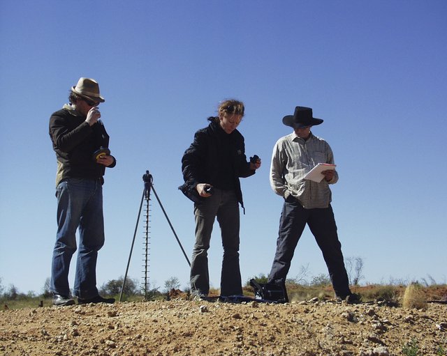 Laing and assistants in 2003 in the Tanami Desert, shooting the series *one dozen unnatural disasters in the Australian landscape*. Photo Peter Burgess.