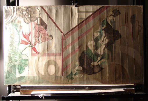 Before treatment
In raking light, it is easy to see the creases that developed when the work was rolled for storage.