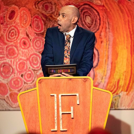 2019Steven Oliver during filming of the TV series, in front of Jakayu Biljabu’s 2008 painting Minyi Puru from the Art Gallery of NSW collection.
Photo courtesy of Noble Savage Pictures. Artwork © Jakayu Biljabu. Licensed by Copyright Agency
